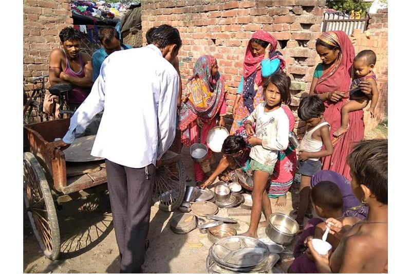 Distribution of old clothes and utensils in our Neighborhood 