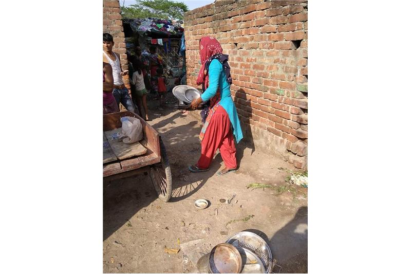Distribution of old clothes and utensils in our Neighborhood 