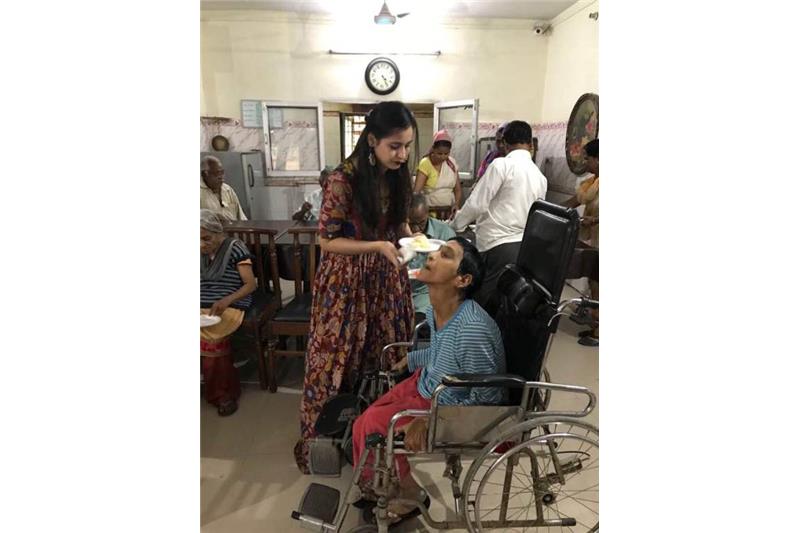 Rupal celebrating Birthday with the residents of Cheshire Home