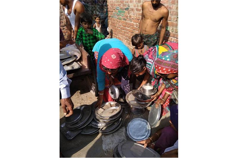Distribution of old clothes and utensils in our Neighborhood 